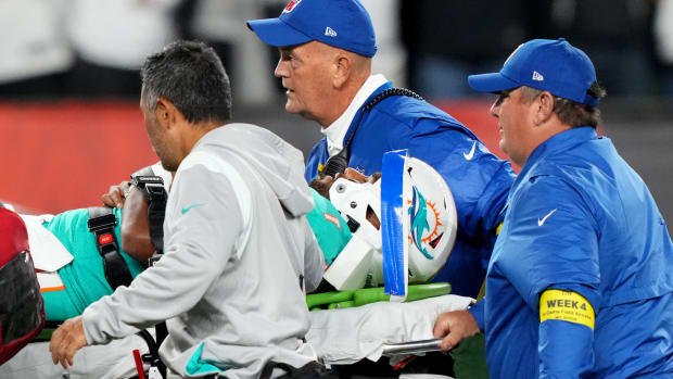 Sep 29, 2022; Cincinnati, Ohio, USA; Miami Dolphins quarterback Tua Tagovailoa (1) is taken off the field after suffering a head injury following a sack by Cincinnati Bengals defensive tackle Josh Tupou (not pictured) in the second quarter at Paycor Stadium in Cincinnati.